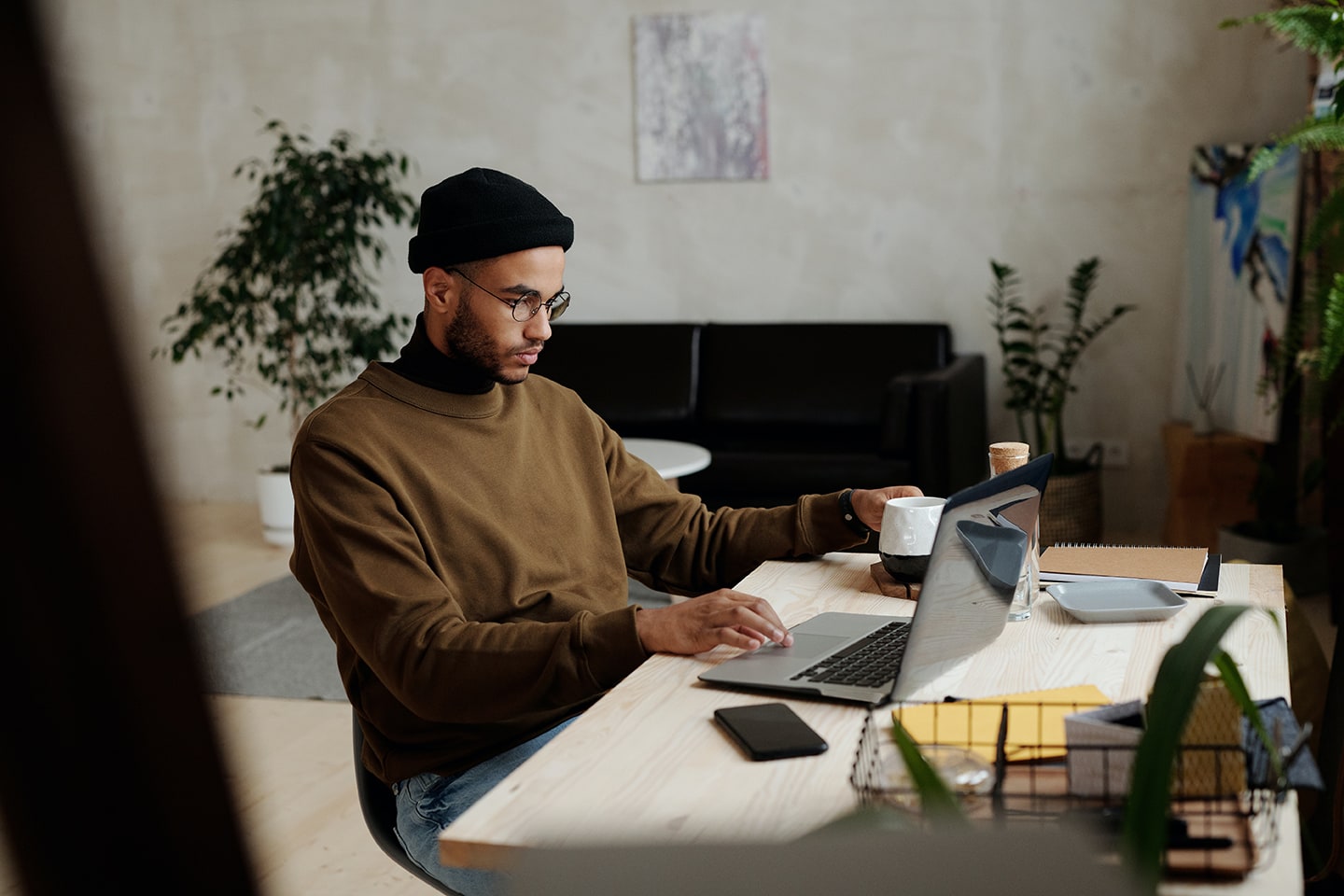 Sales professional reviewing a proposal on laptop